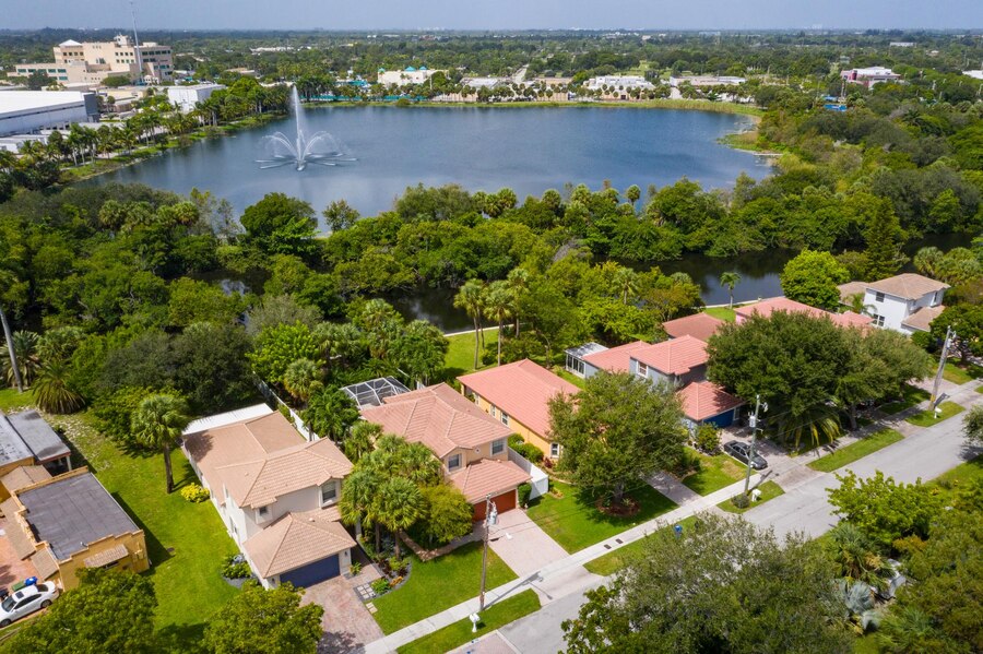 aerial-drone-photoshoot-commercial-area-tropical-vegetation-blue-sky-water-canal_949060-1275